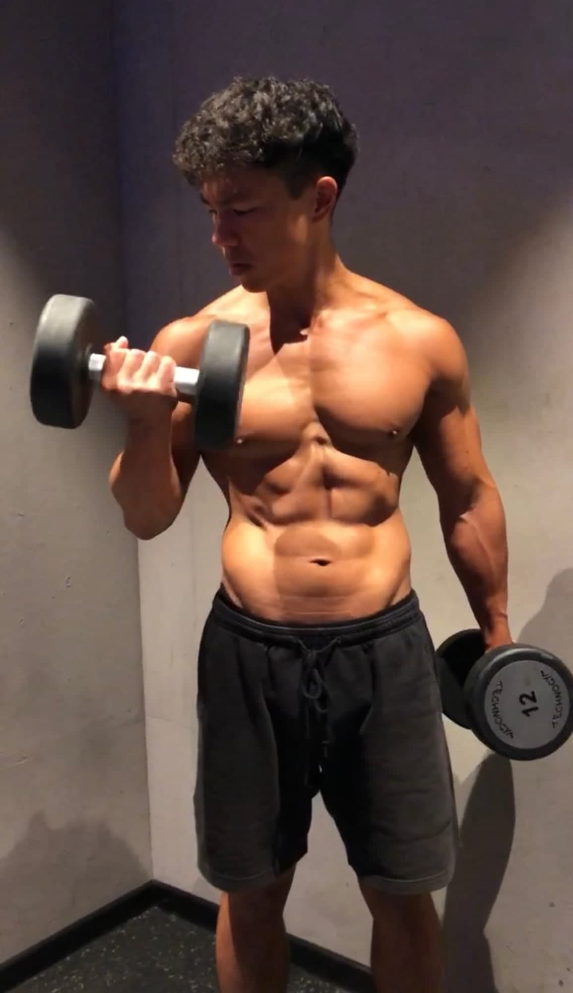 Wilhelm Dang training with dumbbells